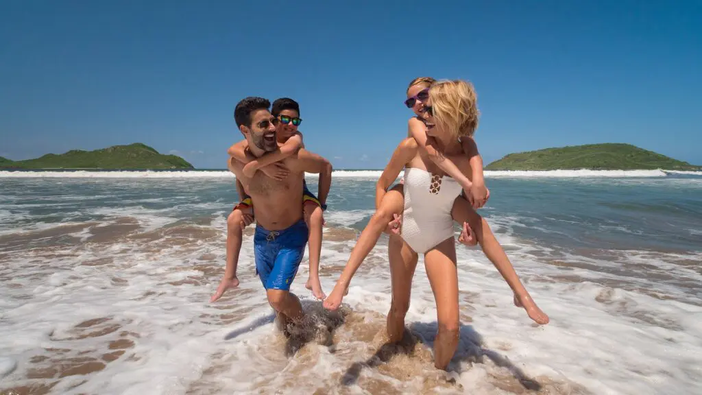 El Cid Castilla Beach Hotel_family coming out the water at beach 2