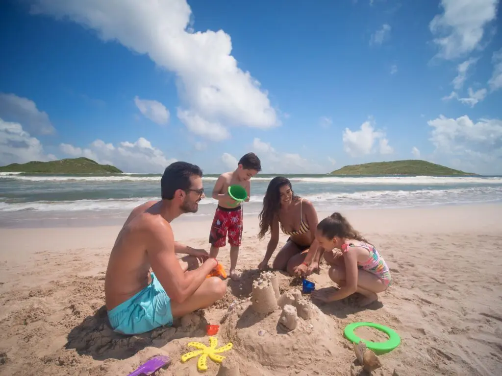 El Cid El Moro Beach Hotel_family sitting on the beach