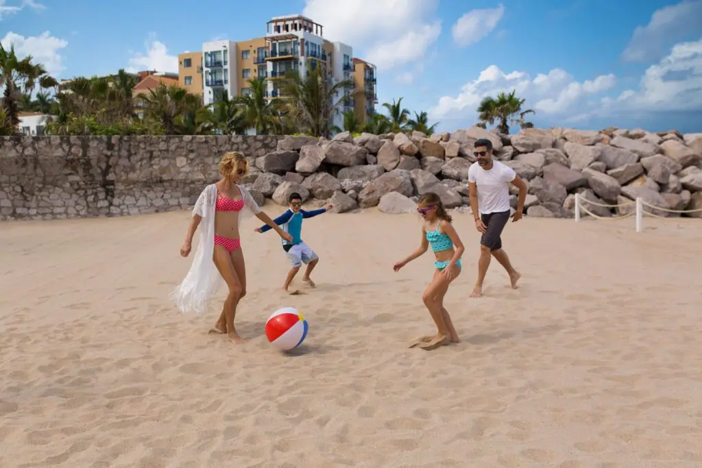 El Cid Marina Beach Hotel_family with beach ball on beach