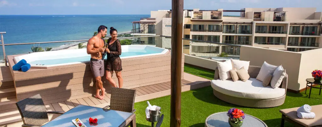 Hideaway at Royalton Riviera Cancun couple by jacuzzi on balcony